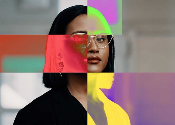 A conceptual portrait of a woman with dark hair and glasses, presented as a grid of blocks with alternating natural tones and vibrant, heat-map-style color distortions in red, green, and yellow.